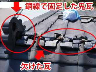 銅線で固定した鬼瓦となんばんの上の欠けた瓦