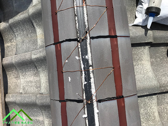 引っ張りながら